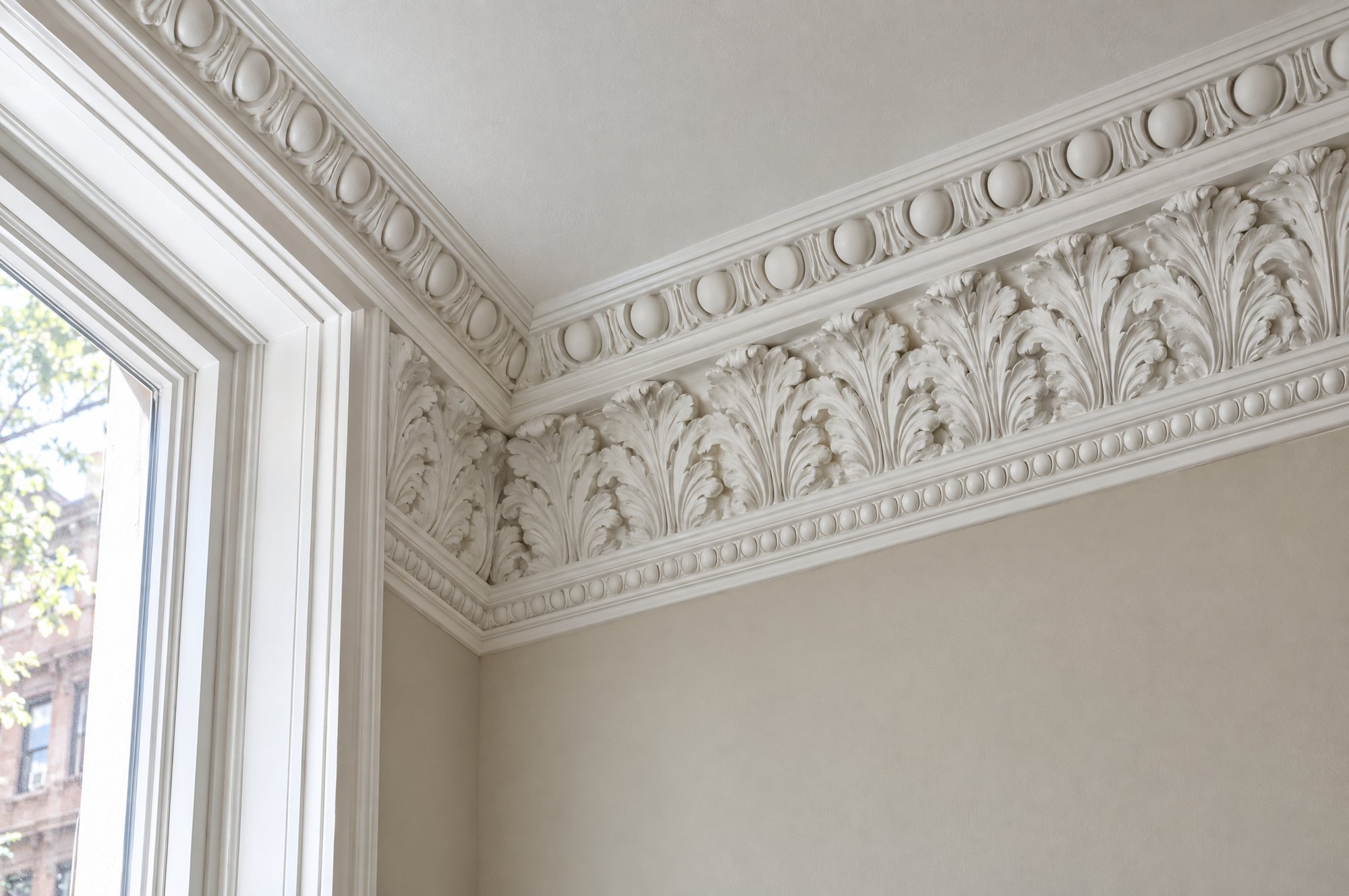 The repaired cornice with the missing run replicated and blended